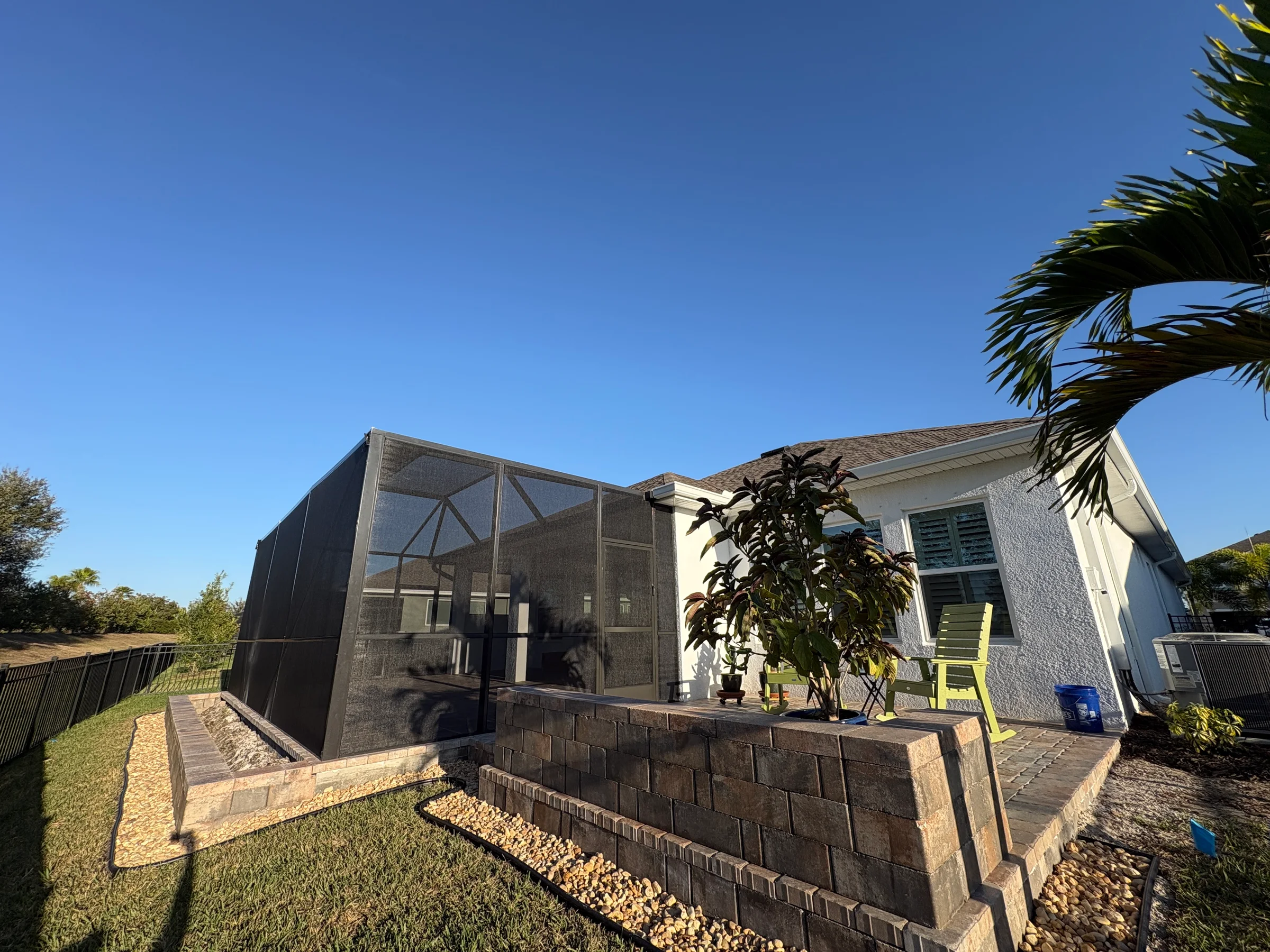 Enclosure and raised paver terrace